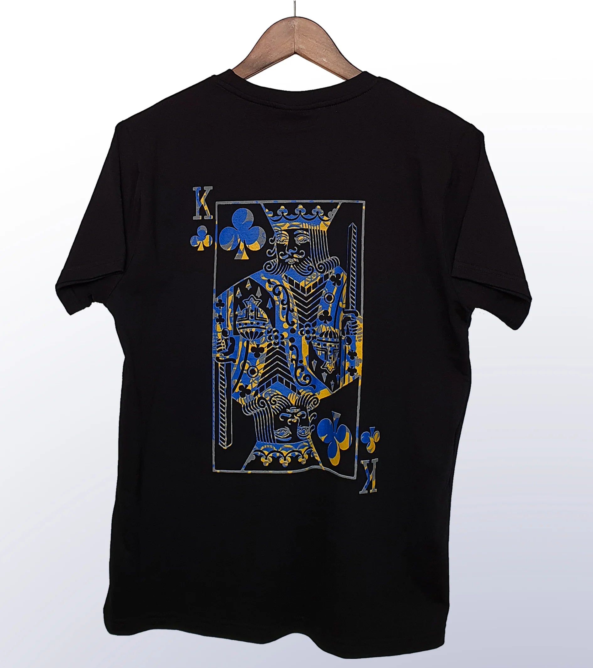 A black T-shirt with a print of the King of Clubs playing card in the center back.